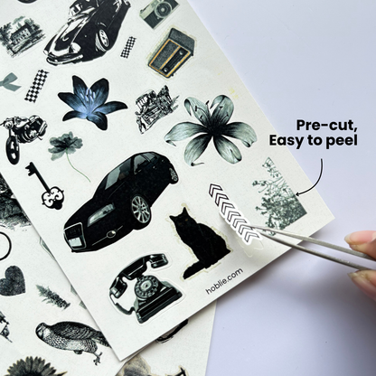 Sheet of pre-cut temporary tattoos with various designs, including cars, flowers, and animals, on a white background.