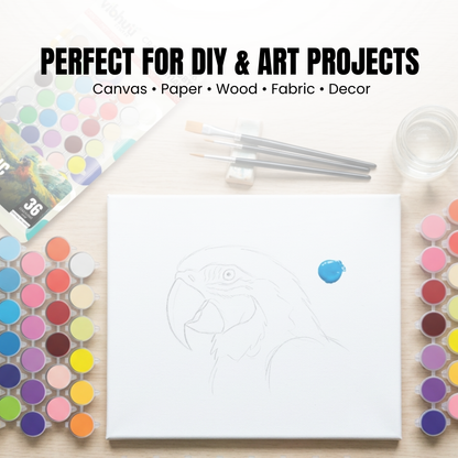 Art supplies including paint, brushes, and a canvas with a design on a white background.
