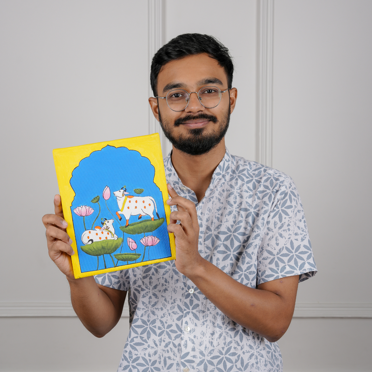 person holding DIY pichwai painting canvas. The best DIY Kits for Adults - india