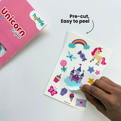 unicorn stickers with a hand holding a sheet of stickers.