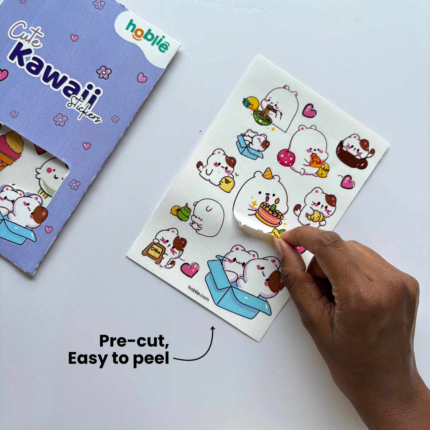 Kawaii stickers with a hand picking up a sticker 